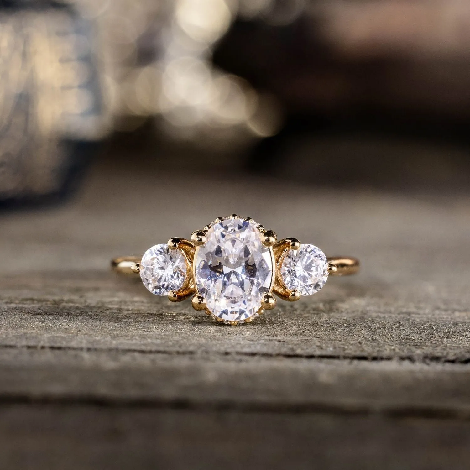 The Wren - Oval Diamond Three Stone Engagement Ring with Round Diamond Accents