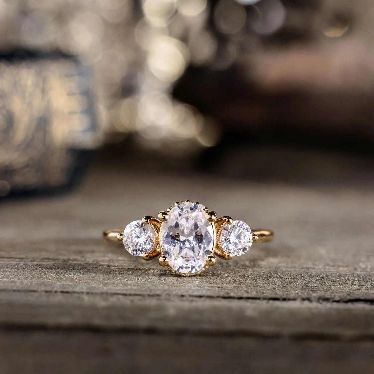 The Wren - Oval Diamond Three Stone Engagement Ring with Round Diamond Accents