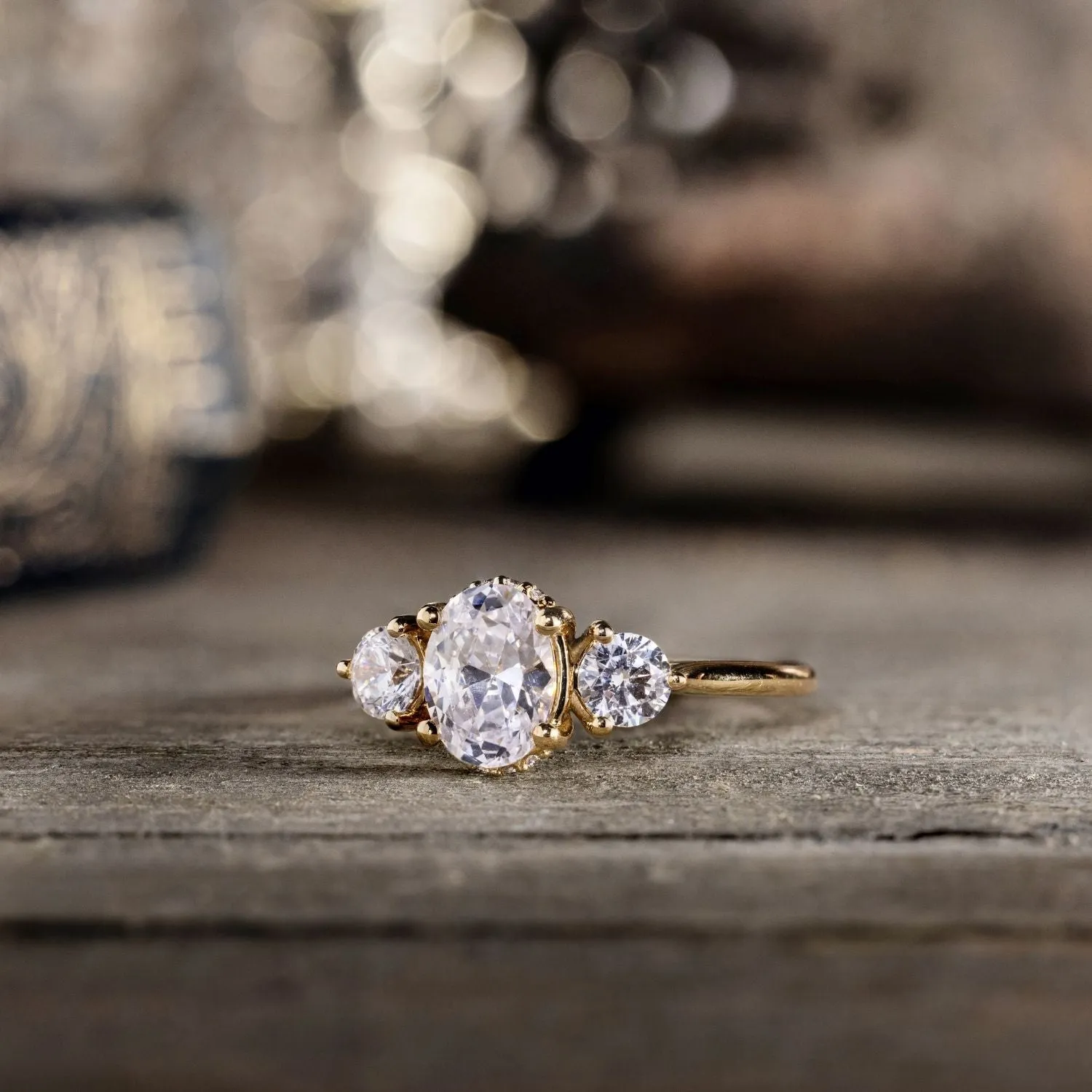 The Wren - Oval Diamond Three Stone Engagement Ring with Round Diamond Accents